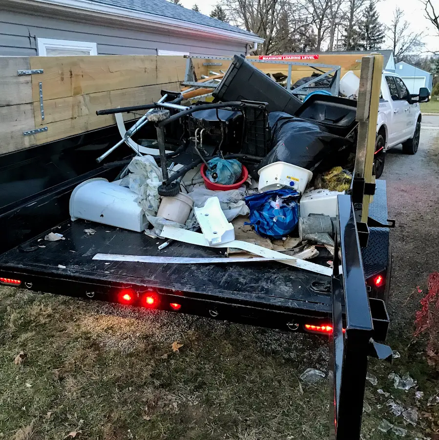 Roll-off dumpster delivered to a residential driveway in Sturgeon Bay
