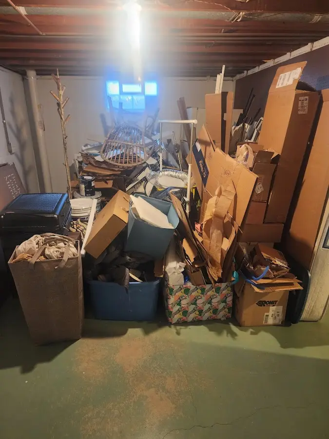 Roll-off dumpster container at job site for 2 Yard Dumpster Rental in Sturgeon Bay